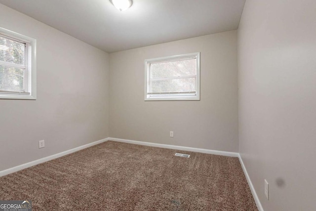 unfurnished room with carpet