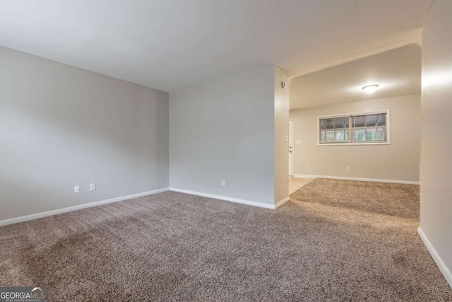 unfurnished room featuring carpet