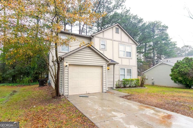 view of front of house featuring a garage and a front lawn