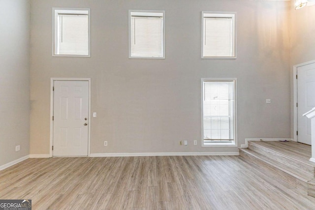 unfurnished living room featuring light wood-type flooring