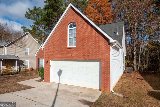 view of side of home featuring a garage