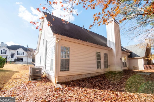 view of side of property featuring central AC unit