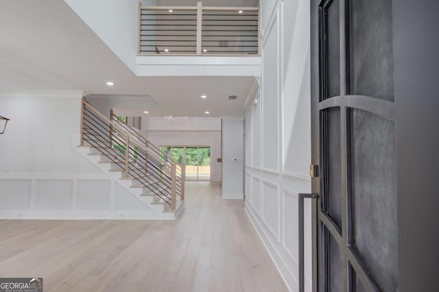 2626 Sardis Way, Buford, GA 30519 - entryway featuring stairs, wood finished floors, recessed lighting, and a decorative wall
