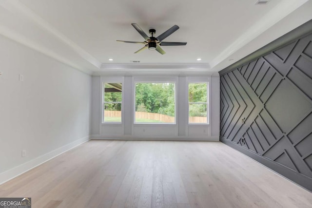 2626 Sardis Way, Buford, GA 30519 - unfurnished living room featuring light wood-style floors, baseboards, a ceiling fan, and a raised ceiling