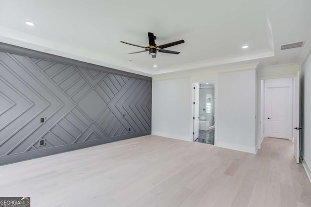 2626 Sardis Way, Buford, GA 30519 - unfurnished bedroom with wood finished floors, recessed lighting, a raised ceiling, baseboards, and an accent wall
