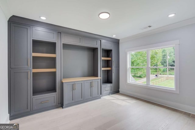 unfurnished living room with light wood-type flooring