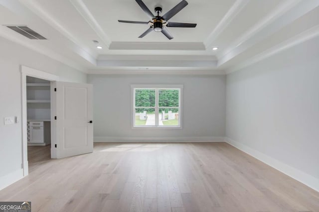 2626 Sardis Way, Buford, GA 30519 - unfurnished bedroom with a raised ceiling, light wood-type flooring, crown molding, and baseboards