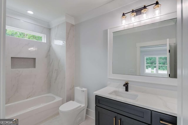 full bathroom with toilet, vanity, a healthy amount of sunlight, and ornamental molding