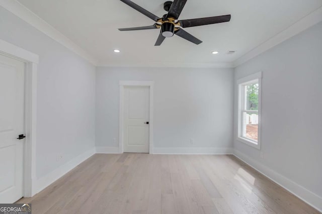 spare room with ceiling fan, ornamental molding, and light hardwood / wood-style flooring