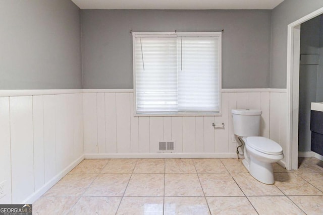 bathroom featuring tile patterned floors and toilet