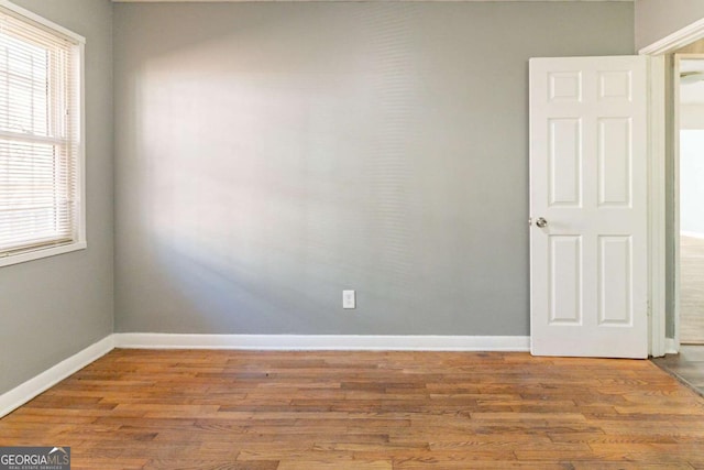 spare room featuring hardwood / wood-style flooring