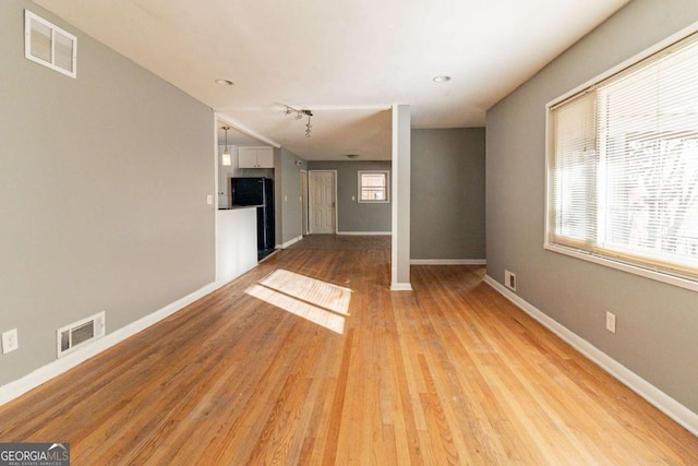 unfurnished living room featuring light hardwood / wood-style flooring