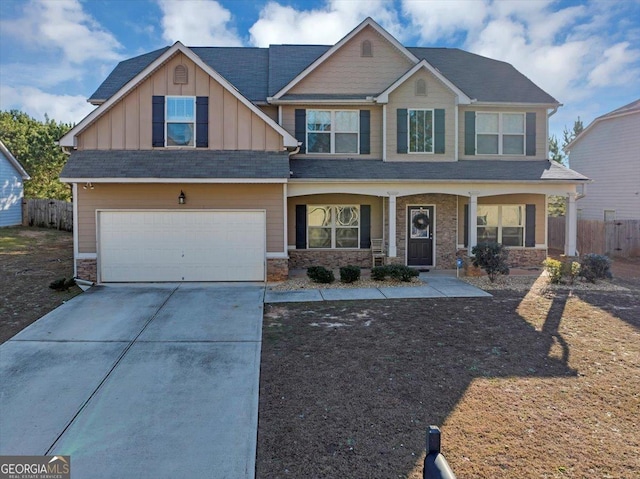 craftsman-style house featuring covered porch and a garage