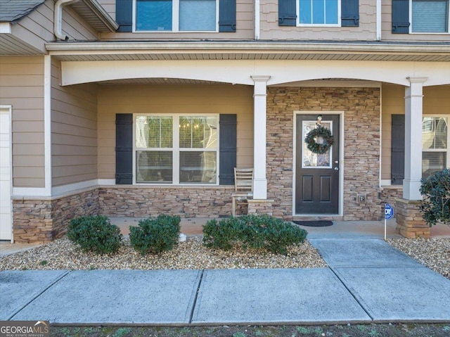 doorway to property with covered porch