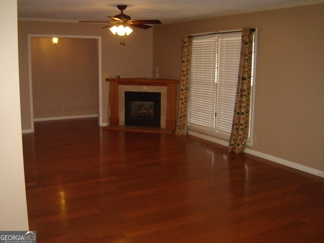 unfurnished living room with ceiling fan, wood-type flooring, and crown molding