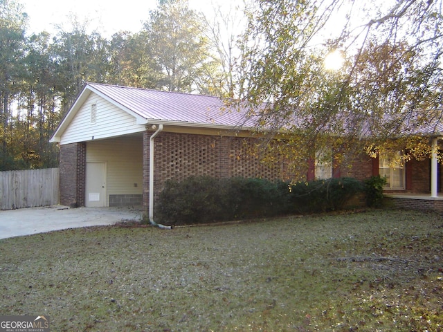 view of property exterior with a yard