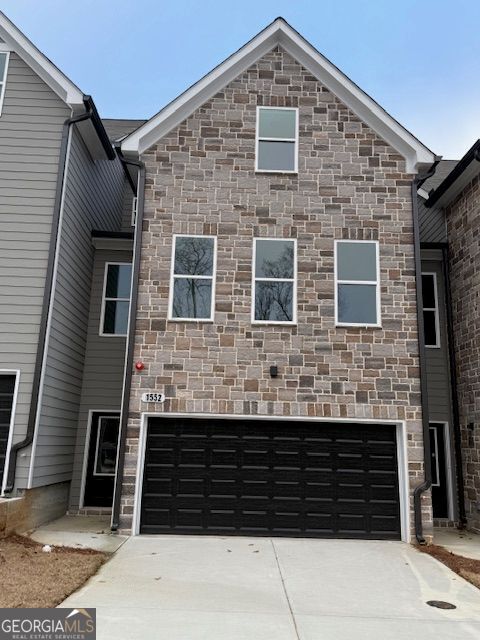 front of property with a garage