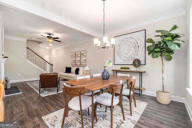 dining space with ceiling fan with notable chandelier, dark wood-type flooring, and ornamental molding