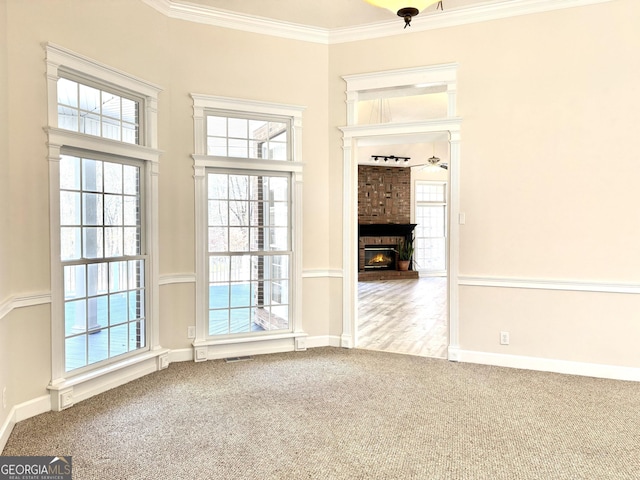 interior space featuring ceiling fan and ornamental molding