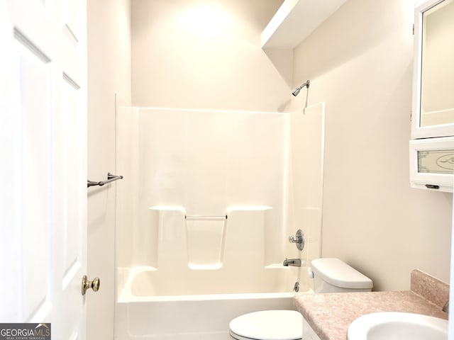 full bathroom featuring vanity, bathing tub / shower combination, and toilet