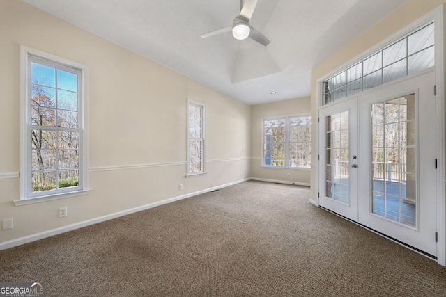 spare room with carpet flooring, french doors, and plenty of natural light