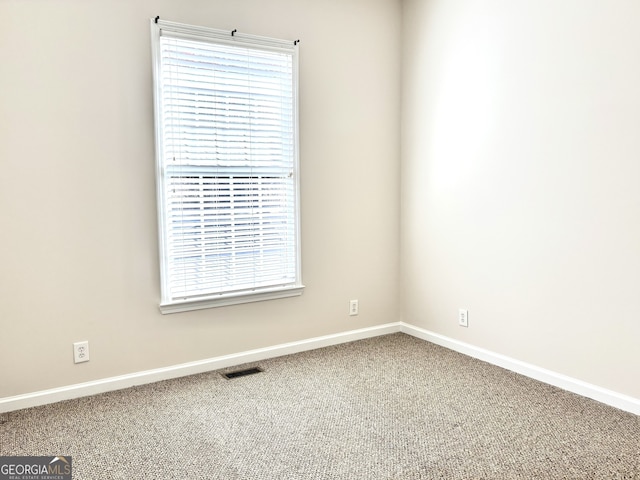 spare room featuring carpet flooring