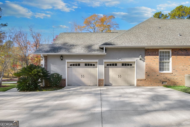 view of side of property featuring a garage