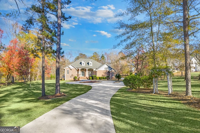 view of front of property with a porch and a front yard