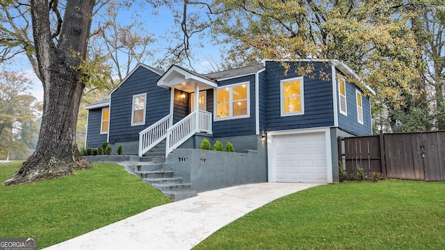 view of front facade featuring a front yard and a garage