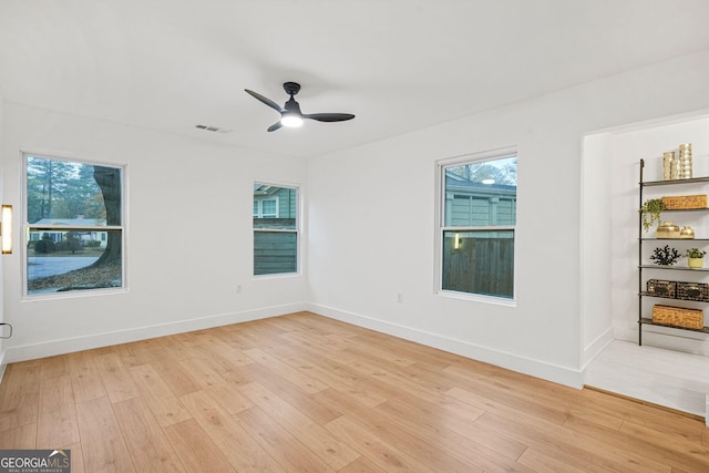 unfurnished room with light hardwood / wood-style floors and ceiling fan