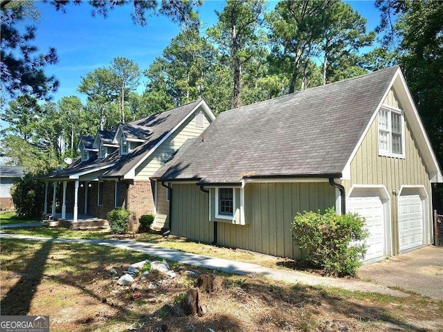 view of side of property with a garage