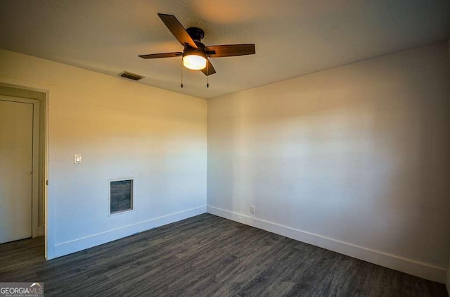 empty room featuring dark hardwood / wood-style floors and ceiling fan