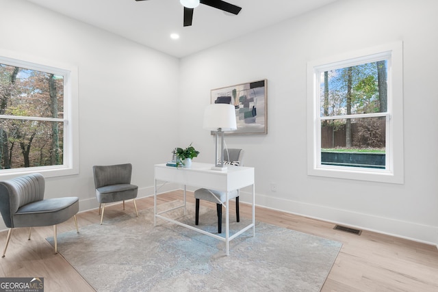 office area with ceiling fan and light wood-type flooring