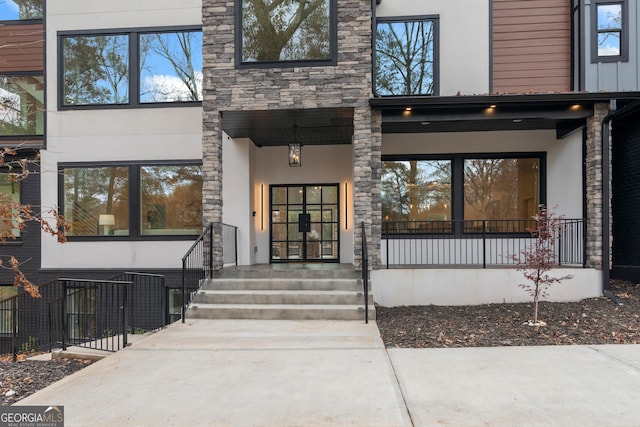 property entrance featuring covered porch