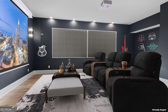 home theater room with hardwood / wood-style floors