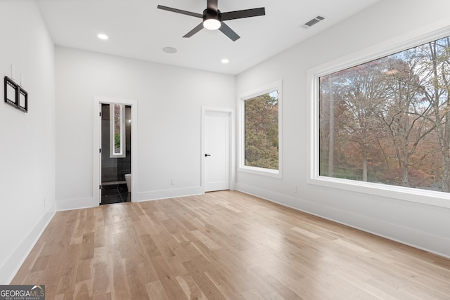 spare room with light hardwood / wood-style floors and ceiling fan