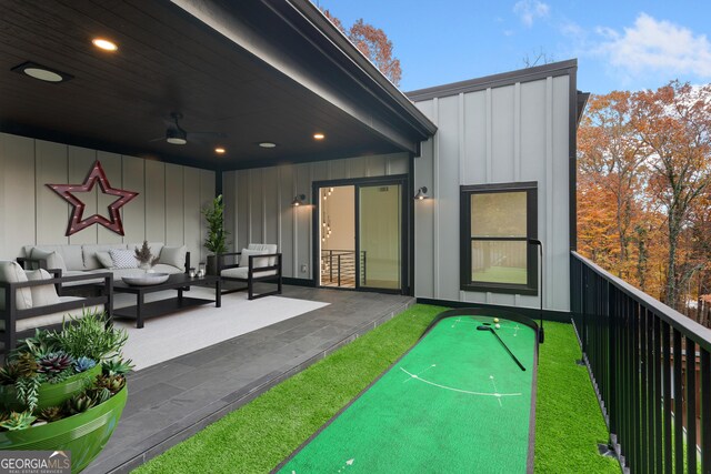 exterior space featuring outdoor lounge area and ceiling fan