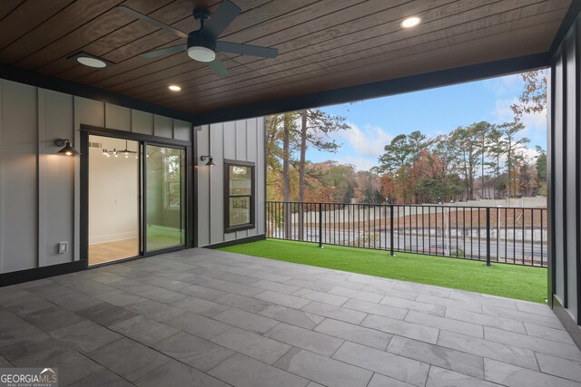 view of patio / terrace featuring ceiling fan and a water view