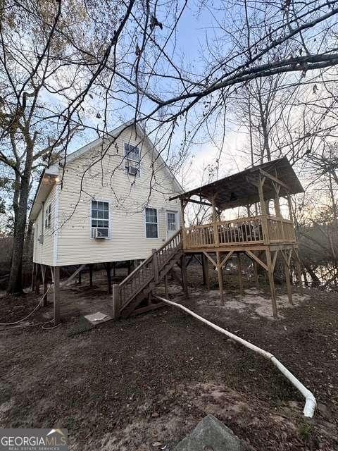 view of yard featuring cooling unit and a deck