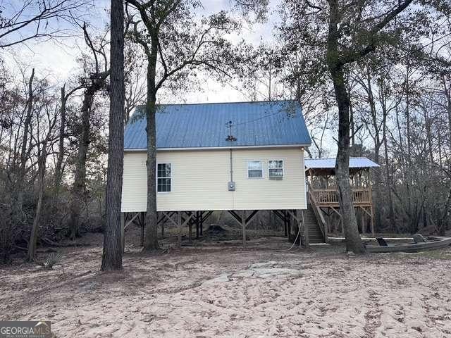 rear view of house with a carport