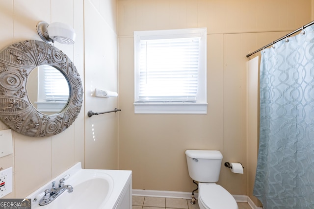 bathroom with tile patterned floors, sink, and toilet