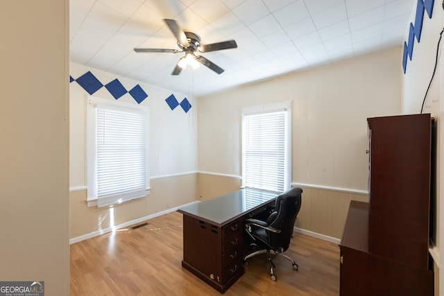 office space featuring ceiling fan and light hardwood / wood-style flooring