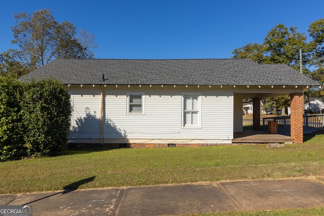 view of property exterior with a yard