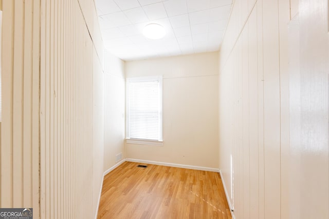 unfurnished room with light wood-type flooring