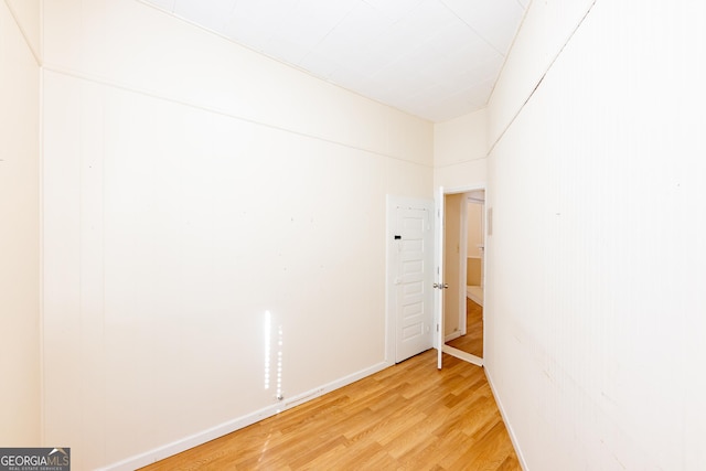 empty room with hardwood / wood-style floors