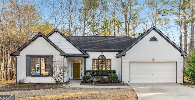 view of front of home featuring a garage and a front yard