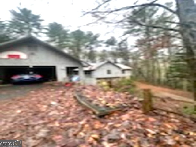 view of side of property featuring a garage