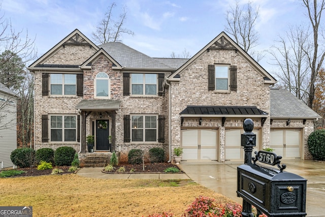 craftsman inspired home featuring a front yard and a garage