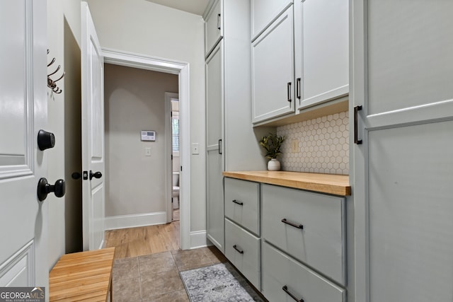 kitchen featuring light hardwood / wood-style floors, stainless steel dishwasher, a healthy amount of sunlight, and sink