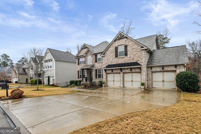 view of front facade with a garage and a front lawn